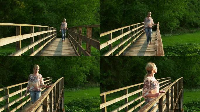 走过桥的女人木桥上行走金发美女看风景