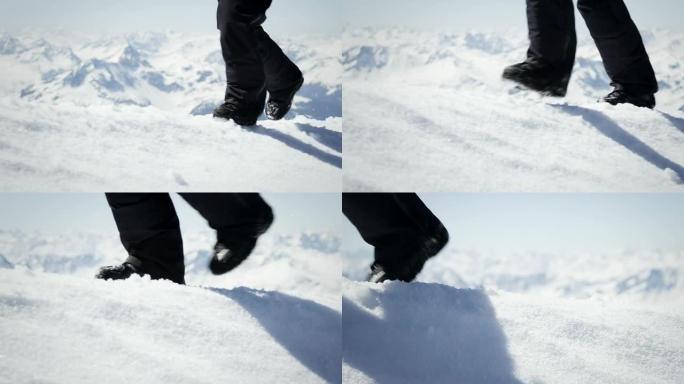 登山者在山上的雪地上行走