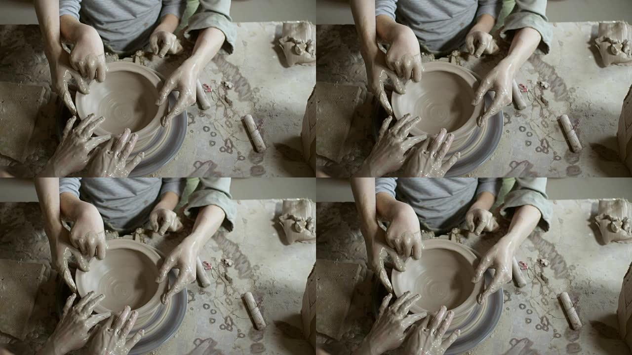 陶轮上家庭成型粘土的电影图