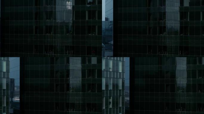 鸟瞰图: 从美丽的黑暗摩天大楼和金融商务区的建筑物外面飞来飞去。