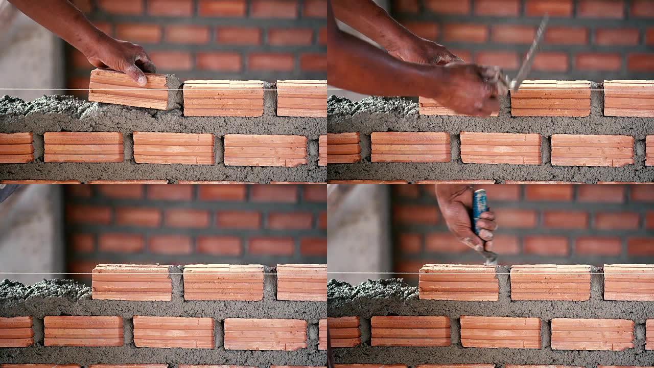 4k镜头特写手工专业建筑工人在新工业场地铺设砖的场景。建筑工业和砖石概念