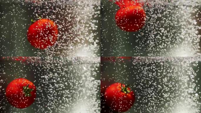 番茄在沸水中掉落升腾起的气泡翻滚的西红柿