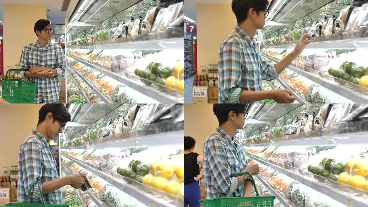 亚洲男子在超级市场购物