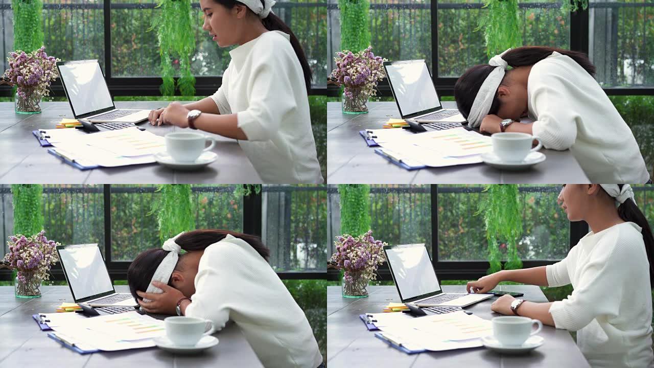 美丽的年轻应变亚洲妇女坐在家里的客厅在笔记本电脑上工作。亚洲商界女性家庭办公室工作文件财务。在家不开