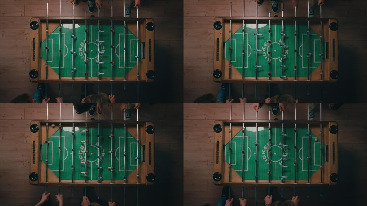 男子在公寓里踢桌面足球的最佳镜头