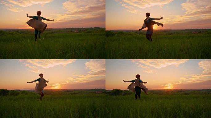 SLO MO快乐的女人在日落时在草地上旋转
