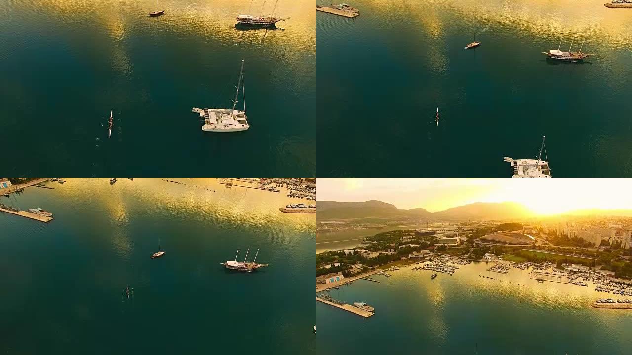 空中四人双桨接近海岸上的城市