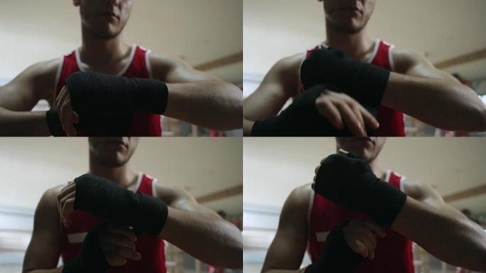 拳击手在戴上手套之前先包扎双手