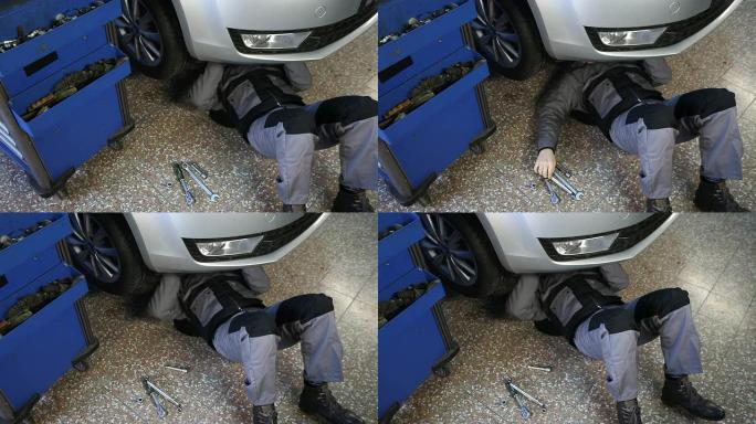 在车底工作的机械师