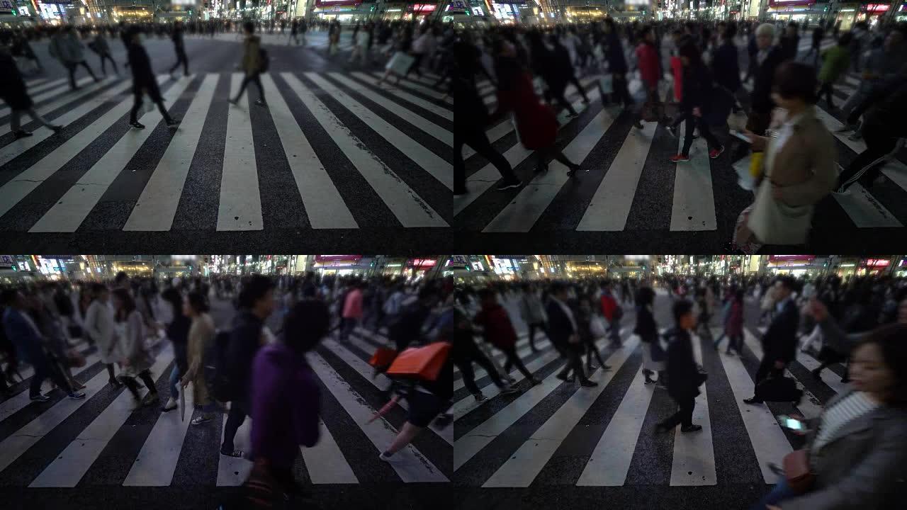 日本涩谷，晚上在城市街道上穿行的人群