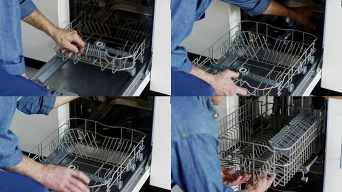 安装洗碗机的男性工人