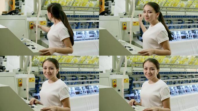 操作纺织机并对着镜头微笑的女人