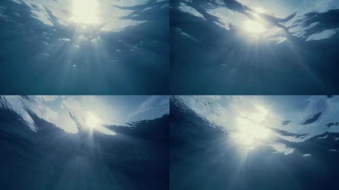 海洋中的水下射线海底水底太阳光照射光效岩
