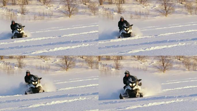 SLO MO Man骑着雪地车穿越雪地