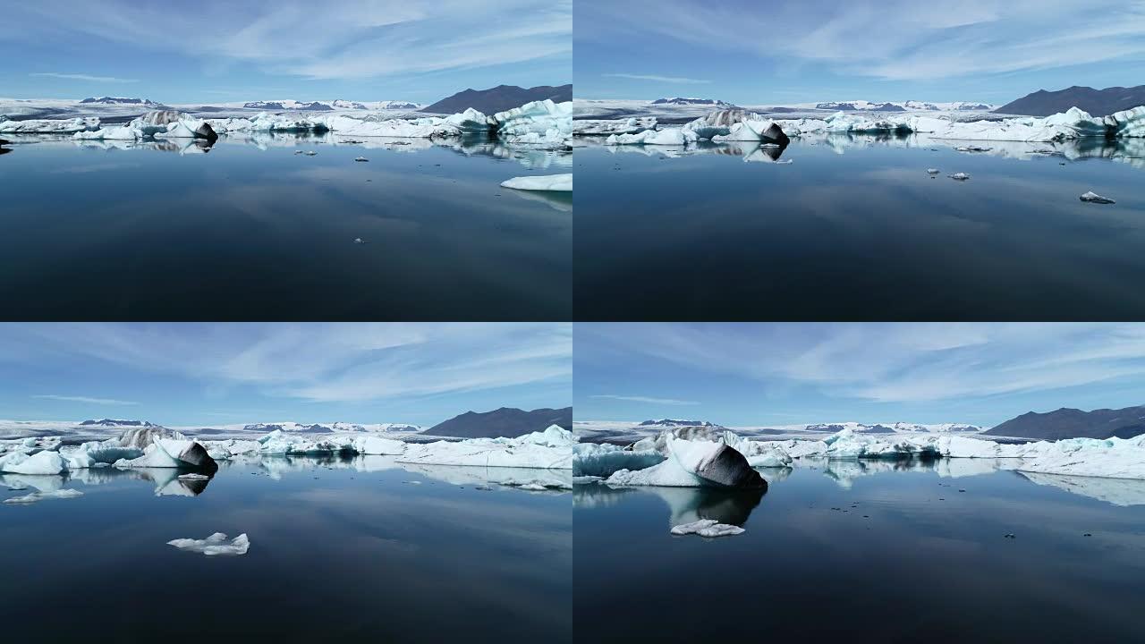 冰岛美丽的Jokulsarlon蓝色冰川泻湖与巨大冰山的低空鸟瞰图