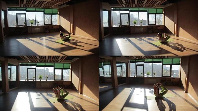 一名女运动员伸直躺在健身俱乐部的垫子上