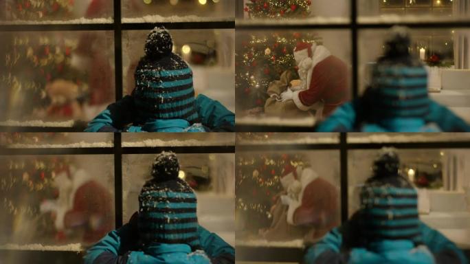 监视圣诞老人在圣诞树下分发礼物的男孩