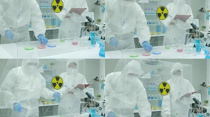 在安全的高水平研究实验室中，科学家将试管中的吸烟化合物与培养皿中的物质混合在一起
