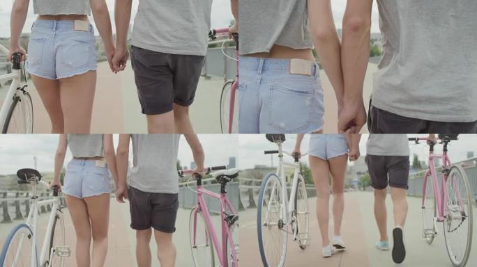 美丽的情侣在城市里骑自行车