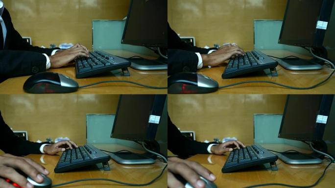 一个年轻人在笔记本电脑键盘上打字的特写镜头，4K(UHD)