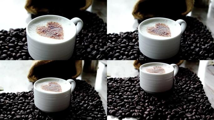 4k镜头场景杯咖啡心形拿铁艺术和咖啡豆的顶视图，桌上装有咖啡袋，创意咖啡和生活方式概念