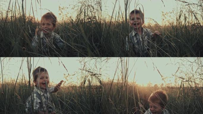 慢动作男孩在草地上笑得很开心