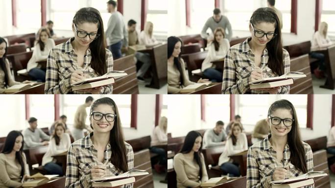 年轻女学生记录写字笑脸