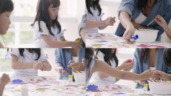 亚洲女孩与朋友一起绘画的特写镜头