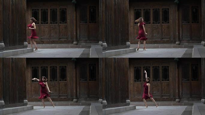 年轻漂亮的中国女人在街上跳舞
