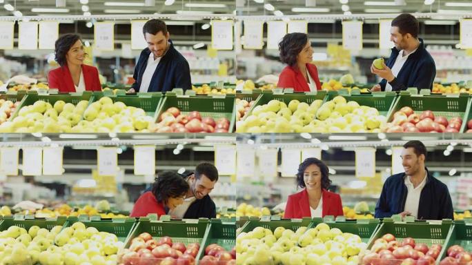 在超市: 幸福的年轻夫妇在商店的新鲜农产品区选择有机水果。丈夫使用智能手机，妻子拿起水果。