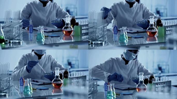 在实验室工作的科学家。
