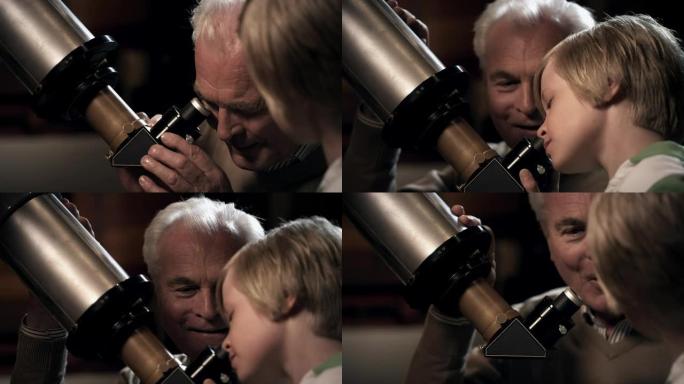 爷爷和孙子带着望远镜