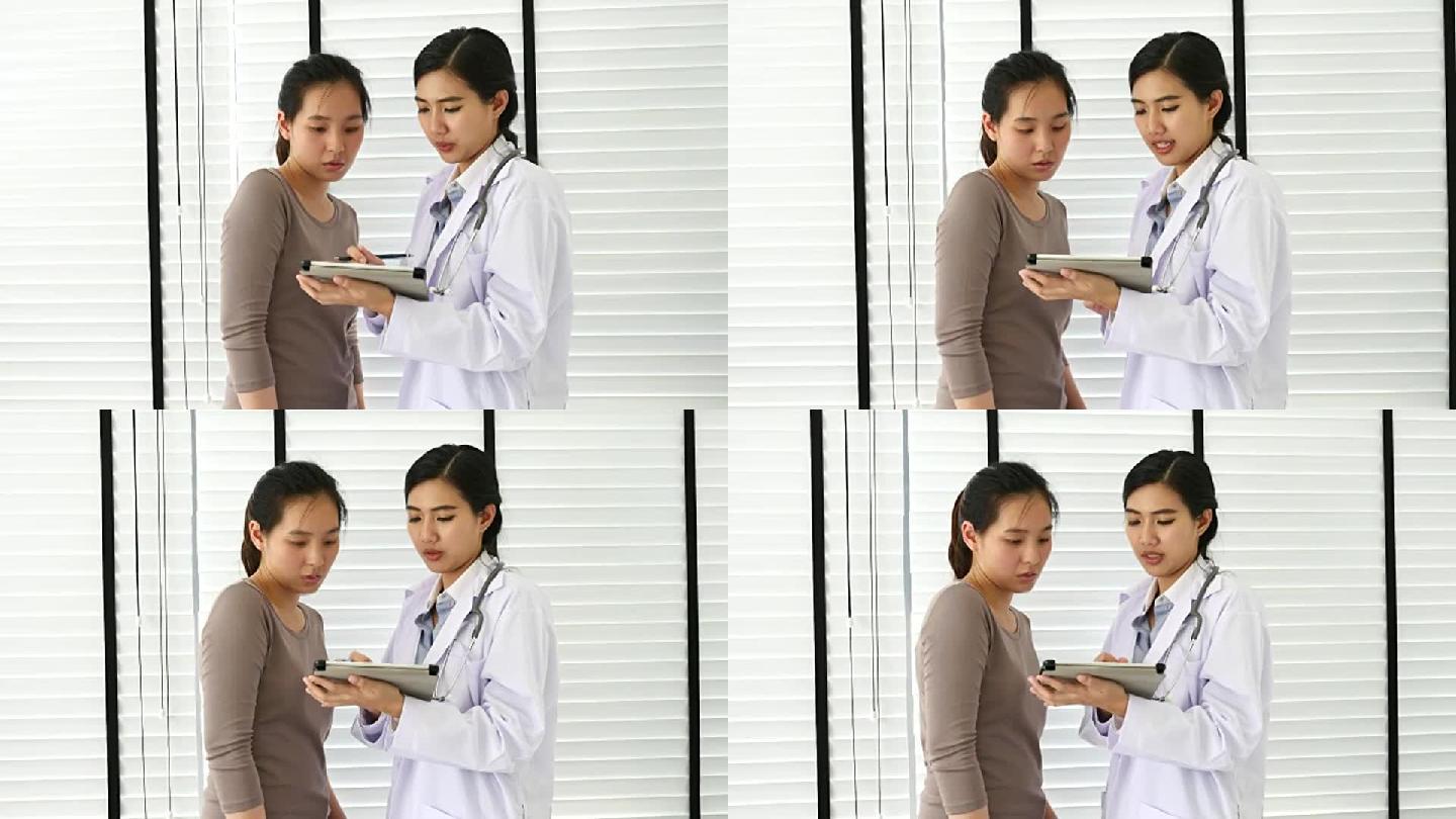 医生在数字平板电脑中与患者交谈