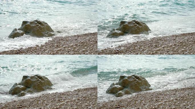 SLO MO海浪拍打海滩上的岩石