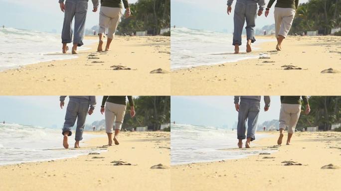 高清超级慢镜头：情侣在佛罗里达海滩散步