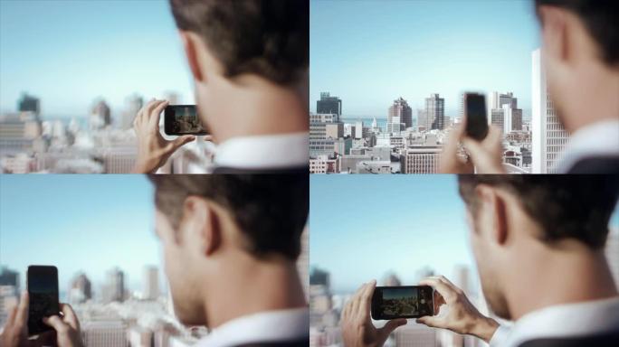 顶楼男子用智能手机拍照