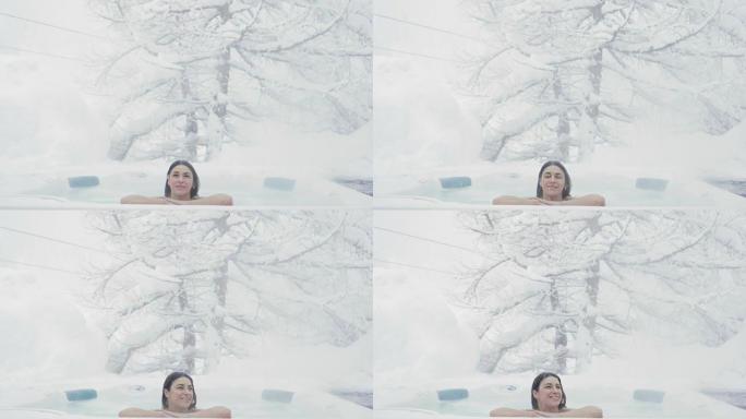 漩涡中一个美丽的女人放松，呼吸清洁的空气，并在大自然中快乐，因为雪从天而降。