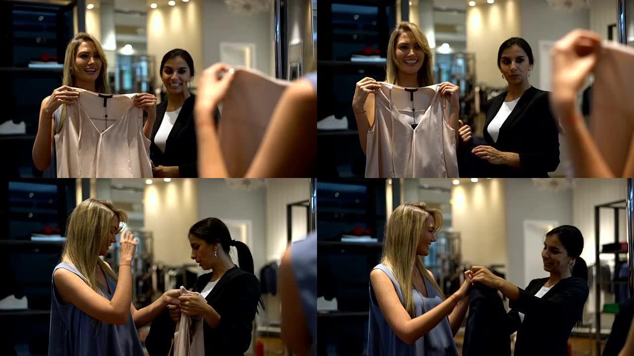 友好的女售货员在服装店向漂亮的顾客推荐一件衬衫