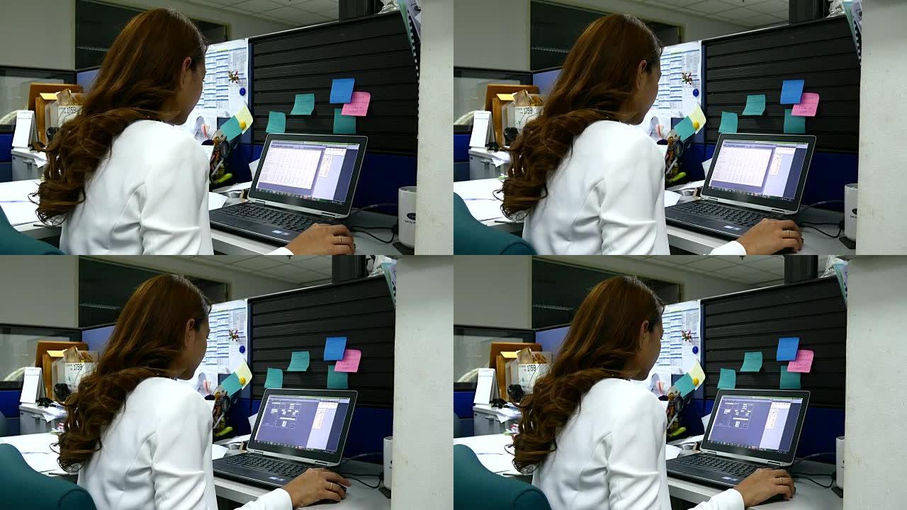 4K: 在办公室工作的亚洲女商人，变焦视图