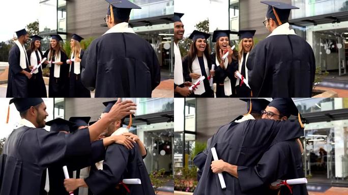 一群获得博士学位后鼓掌拥抱的朋友非常高兴