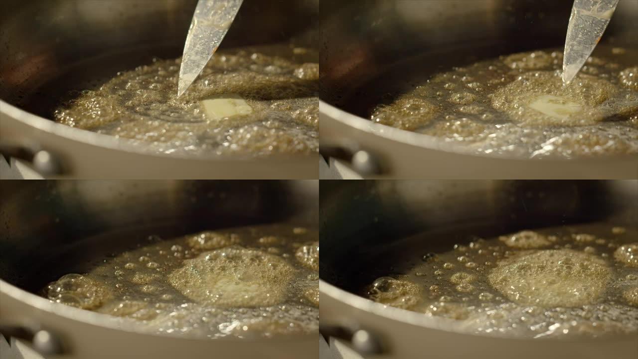 黄油在热锅中融化黄油在热锅中融化