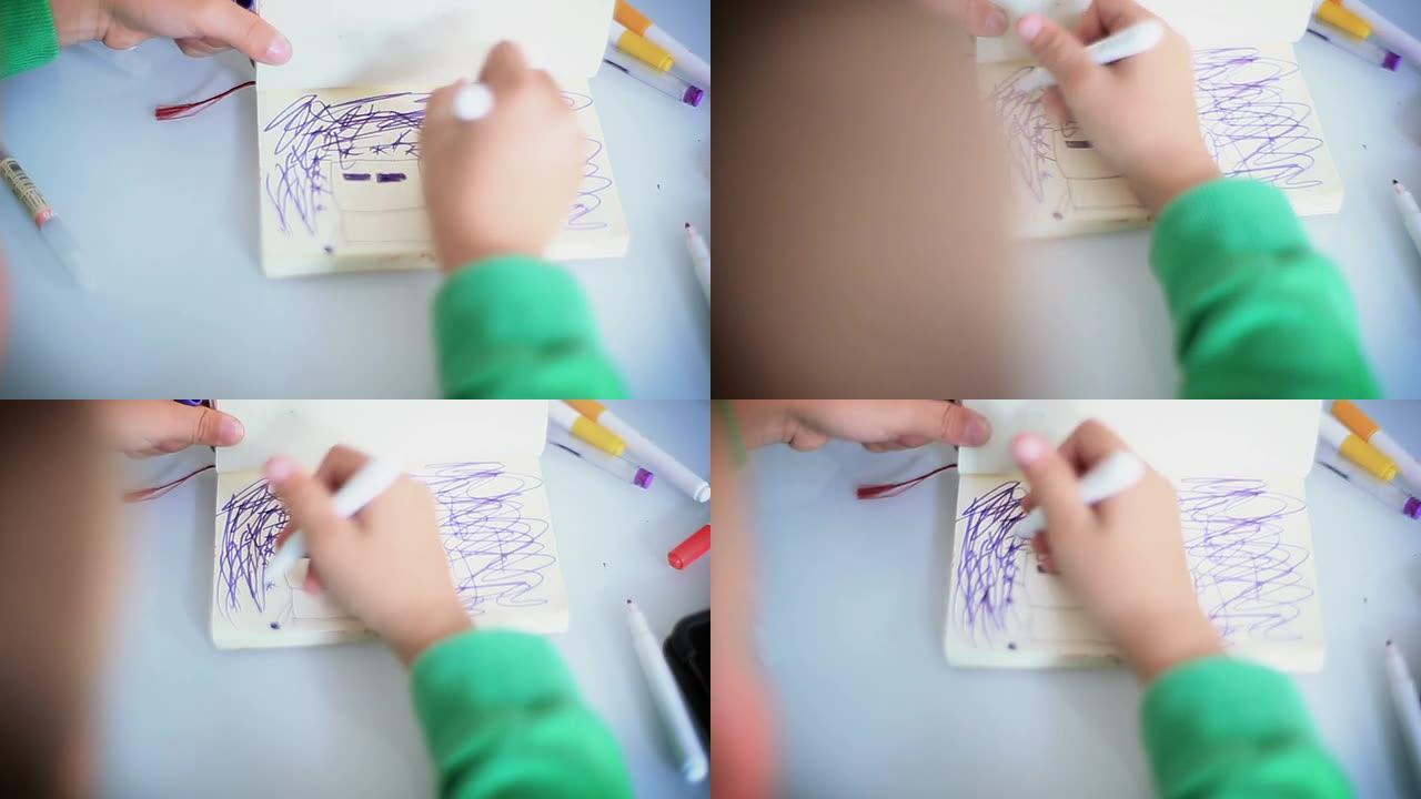男孩在纸上画画男孩在纸上画画乱协理
