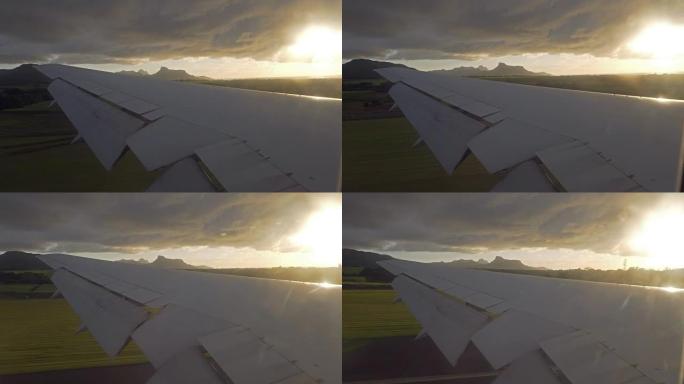 飞机在日出时降落在热带岛屿上