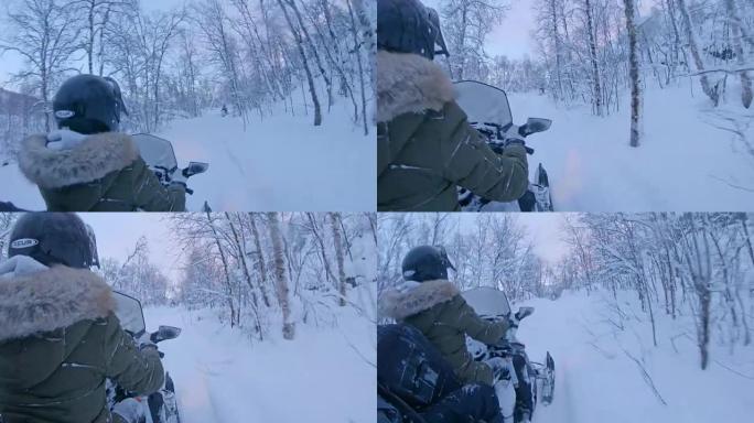 SLO MO POV骑着雪地车穿过白雪皑皑的森林