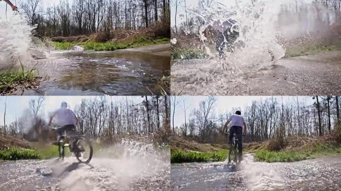 SLO MO山地自行车手在水坑中漂流