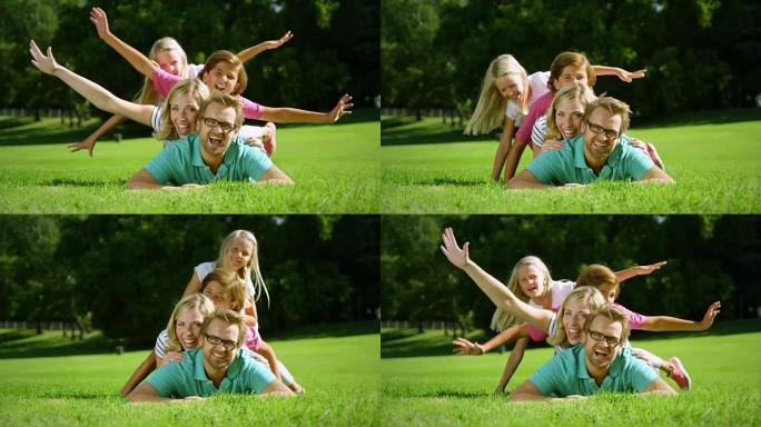 一家人躺在草地上一家人躺在草地上幸福