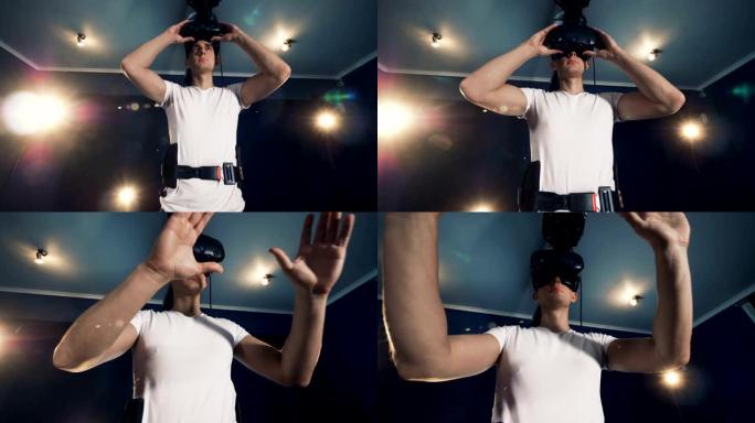 在游戏室里戴着VR眼镜的男子。机器人VR控制论游戏系统。
