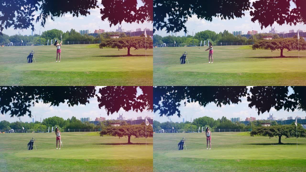 一个女孩在球场上打高尔夫球时击球。高尔夫球场上的高尔夫球手。
