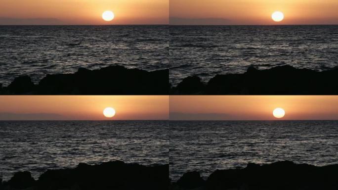 克里特岛。日落海滩