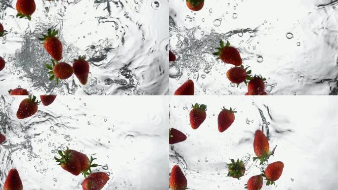 草莓的慢动作掉入水中并飞溅。